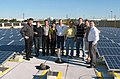 The crew of J. Sussman, Inc. stands in front of the solar panel installation