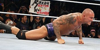 Randy Orton doing push ups before performing t...