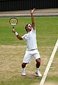 Roger Federer serving at the 2009 Wimbledon Championships.