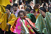 Colourfully-dressed dancers