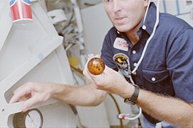 Photographic documentation showing STS-51F crew activities. Views include: Mission Specialist (MS) F. Story Musgrave with liquid drop in front of him.