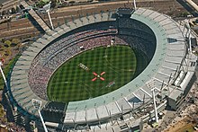 To make large numbers of people comprehensible, the capacity of large stadiums is often used. Here the Melbourne Cricket Ground (MCG) is in the process of filling with 100,016 spectators on AFL grand final day in 2010. AFL Grand Final 2010 on the Melbourne Cricket Ground.jpg