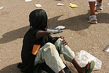 A person with disability begging for money at Mount Arafat, 2011.