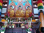 Statues of Bhaisajyaguru (left), Gautama Buddha (middle) and Amitābha (right) at the Mahavira Hall.