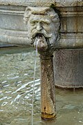 Mascaron and small column.