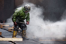 A complete PPE ensemble worn during high pressure cleaning work High-Pressure-Cleaning-with-Personal-Protective-Equipment.jpg