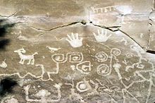 An Ancestral Puebloan petroglyph in Mesa Verde National Park. The boxy spiral shape near the center of the photo likely represents the "sipapu", the place where the Ancestral Puebloans emerged from the earth in their creation story. Hopi petroglyph - Mesa Verde National Park.jpeg