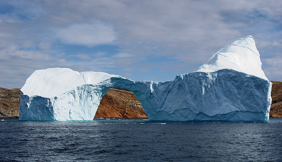 Iceberg with a hole near Sanderson Hope south of Upernavik, Greenland. This photo demonstrates that it is possible to get a point and shoot photograph taken with a typical compact camera featured. I am honored that this photo is used as the lead image in water, which has about 5,000 page views per day.