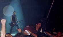James Hetfield performing with the band during its tour for Load in 1996 James Hetfield - Cardiff 1996.jpg
