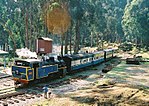A train of the Nilgiri Mountain Railway stops for water at Ketti in 2005