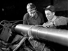 Workers machining a QF 4-inch naval gun Mk XVI in Sorel, 1940. QF 4 inch Mk XVI gun manufacture Sorel Industries 1940 LAC 3193082.jpg