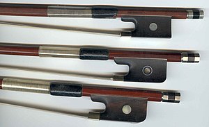 Violin, viola, and cello bow frogs (top to bottom)