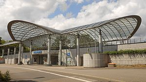 Transparent curved roof covering station building