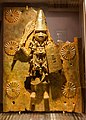 Benin Bronze, kept in Horniman Museum, depicting a warrior with similar though also quite distinct garments, and pose.