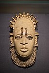 Pendant mask; by Edo people (Nigeria); 16th century (?); ivory and iron; height: 24.5 cm; British Museum (London)[107]