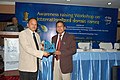 Baharul Islam being handed over a Dept of IT memento at a Govt of India function at Guwahati (India) Feb 2010