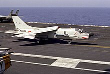 An F-8E(FN) landing aboard Dwight D. Eisenhower, 1983. F-8E(FN) catching wire on USS Eisenhower (CVN-69) 1983.JPEG