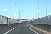 大府IC豊田方面入口からのランプを昇ると名古屋南JCT上り側道に流入する