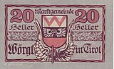 20-Heller-Schein mit Wörgler Wappen und einem geflügelten Eisenbahnrad, das den Aufstieg Wörgls als Eisenbahnknotenpunkt symbolisiert.