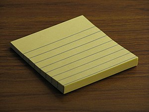English: A small pad of Post-It notes.