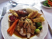 Christmas dinner -2019-12-22 Roast turkey served vegtables, pigs in blanket, stuffing, cranberry sauce tartlet, and gravy, Trimingham.JPG