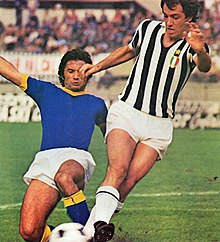 From left to right: Verona's midfielder Madde versus Juventus' forward Bettega in 1975: "short shorts" were the norm from the mid-1960s to the early-90s, when they changed back to a classic longer and baggier form. 1975-76 Serie A - Juventus v Verona - Sergio Madde, Roberto Bettega.jpg