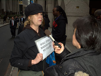 English: A protester outside AIG's headquarter...