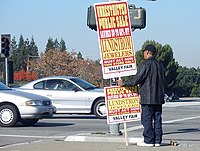 Paying people to hold signs is one of the oldest forms of advertising, as with this Human directional pictured above