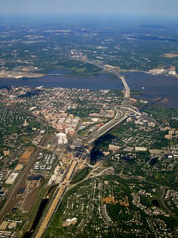 The southern portion of the Capital Beltway along the Potomac River, featuring portions of Washington, D.C., Maryland, and Virginia. Old Town Alexandria, Joint Base Anacostia-Bolling, and National Harbor, Maryland are visible. Alexandria, Virginia (6045513083).jpg