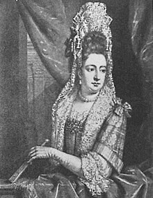And old black-and-white engraving from a painting of a woman with a tall and complicated headdress, holding a folded fan and wearing gloves.