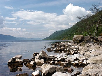 The rocky shoreline of Loch Ness, Scotland