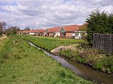 Westfield Beck behind housing on the west of New Earswick