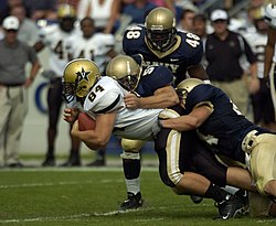 Tackle beim American Football (von U.S. Navy)