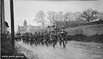 Members of the 27th Battalion marching through Beaucourt-sur-l'Ancre in the Somme, France, 7 April 1918