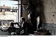 German soldiers positioning themselves for urban warfare (colourised) Bundesarchiv Bild 101I-617-2571-04, Stalingrad, Soldaten beim Hauserkampf Recolored.jpg