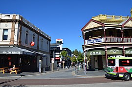 Small buildings around a one-way road