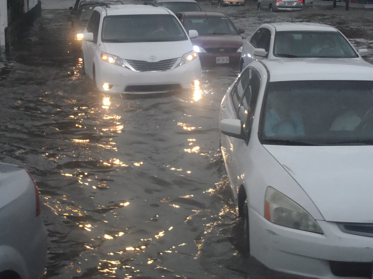 Flooded street and vehicles.JPG