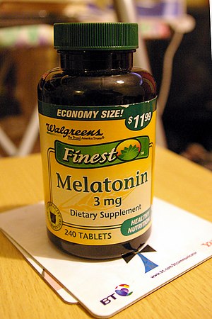 A bottle of melatonin tablets