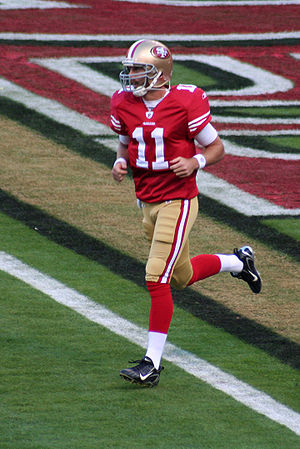 Alex Smith running onto the field before a 200...