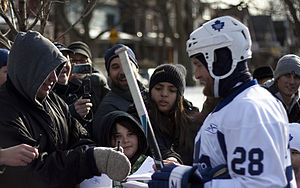English: Number 28 Colton Orr signs autographs...