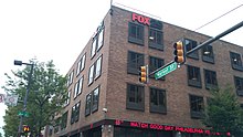 A four-story brick building with Fox 29 signage and an electronic news ticker