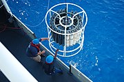 Crew of the NOAA Ship PISCES recover a large CTD-rosette.