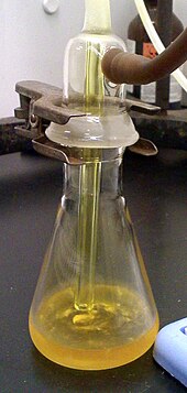 Liquid chlorine analysis Liquid chlorine in flask.jpg