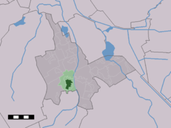 The village centre (dark green) and the statistical district (light green) of Vries in the municipality of Tynaarlo.