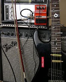 A prepared guitar, in which various metal objects have been inserted between the strings and the neck. Myprepguitar.jpg