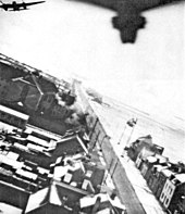 NZ Mosquitoes over Amiens during Operation Jericho, the jailbreak raid. Operation Jericho - Amiens Jail During Raid 1.jpg