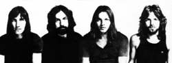 A black and white photograph of four Pink Floyd members