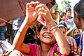 A forcedly displaced Rohingya girl queued and waiting with other hundreds to collect food and supplies at Kutupalong makeshift refugee camp.