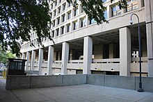 The second-floor viewing arcade on 9th Street NW in October 2012, criticized as dark and cavernous by Chicago Tribune critic Paul Gapp Second floor viewing arcade - east facade - J Edgar Hoover Building - Washington DC - 2012.jpg