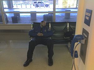 TSA employee sleeping at Reagan National Airpo...